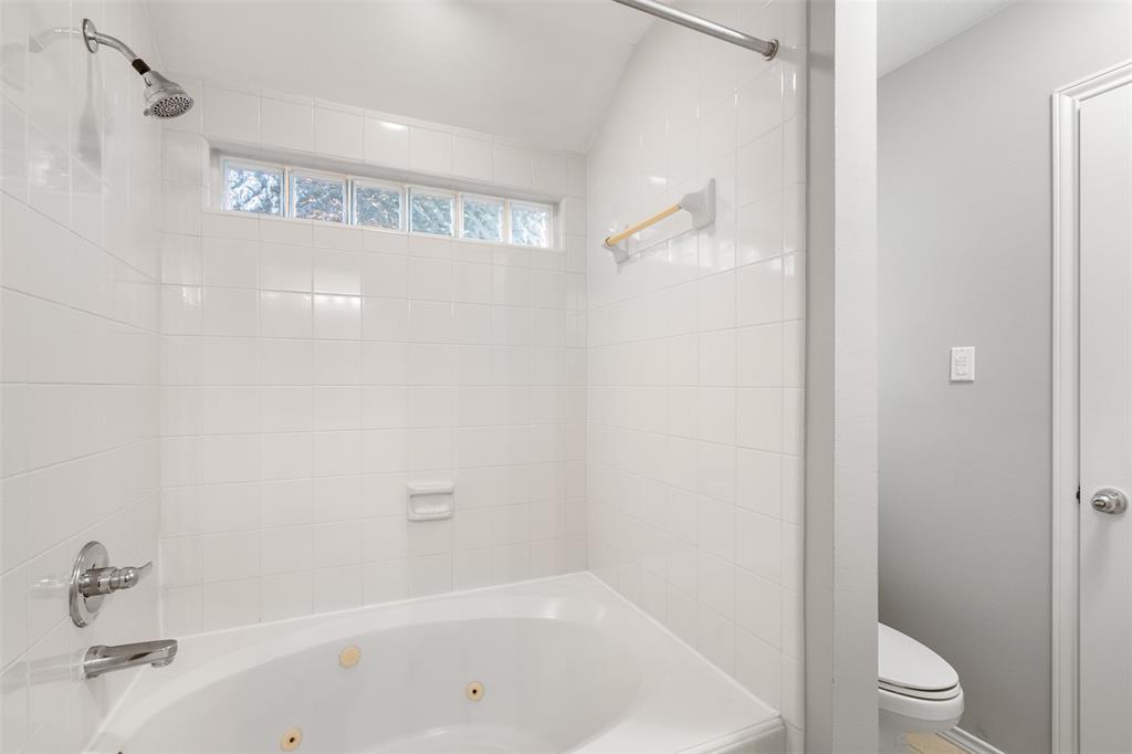 Large jetted tub and shower in full bath.