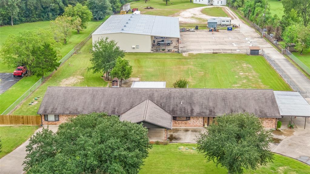 510 Barbers Hill Road 1 Highlands, Texas Almost 5 acres of Commercial/Residential Property with a 4000 sq. ft. single story home, 9000 sq. ft. shop with offices, Bay doors, plenty of storage, overhang and a completely remodeled 20x80 Mobile Home. Aerobic Septic System was installed in 2018. Water Well, Extra Parking. Inside this Beautiful Custom Built home you will find large rooms with plenty of living and entertaining space for everyone. In house vacuum system, double sided fireplace, 6x36 enclosed breezeway between the home and garage, 2 master bedrooms and much more. If you are looking for a place that has it all, your look is over!!! More Photos coming soon.