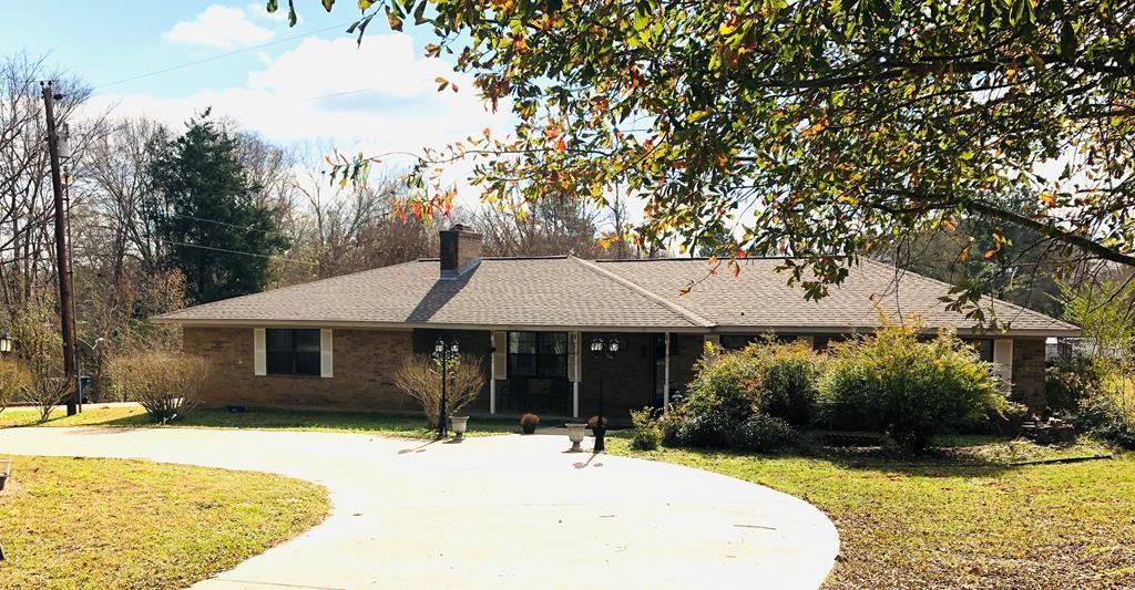 6397 S Fm 225 Nacogdoches, Texas Classic 3br/2bth home on 5 acres. The well done converted garage added a great den, large office and spacious utility room. With Hwy 225 frontage, an approx. 40 X 40 insulated shop , a clean and functional 3br/2bth auxiliary building, and all that ....just minutes from town......so many possibilities. There is a large fenced yard with another small pasture at the rear of the acreage. Beautiful landscaping and a comfortable back deck for cool evening conversations. There aren't many of these type properties available. Don't let it slip by you.