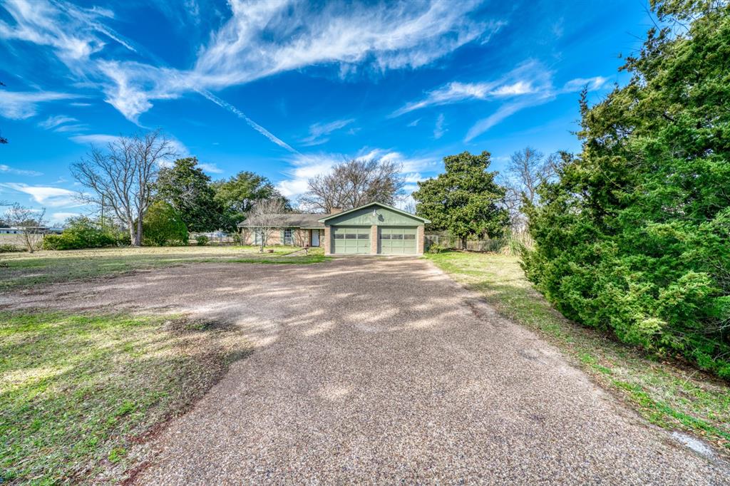 1972 Fm 1452 Madisonville, Texas Location, Location, Location. West Side Madison County Home and Acreage featuring 4/2/2.5 Home with Barn, Pond, and Long Paved Road Frontage. The brick home sits on top of a nice knoll overlooking the acreage where wildlife is often seen. Raise cattle and/or horses, hunt and fish on this all around property making it your full time residence or a weekend retreat. Located approximately 5 minutes from downtown and schools and 30 minutes from Bryan/College Station. The property offers lots of opportunity for those wanting a small acreage ranch in the country but is still conveniently close enough to the city for everyday needs.