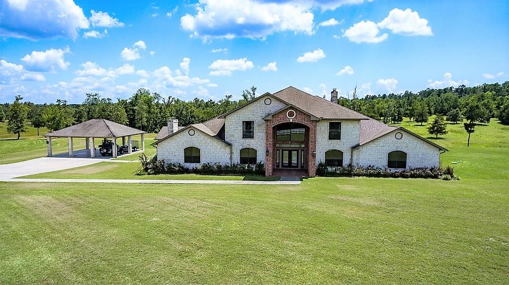 6845 FM 942 Livingston, Texas Magnificent and Incomparable.Showcase on 55 Acres with 2 Stocked Ponds, Rolling Terrain, Woods and Pastures, w/White Rail Fencing. Stunning Marble Entry w/Sweeping Staircase and Chandelier. 5 Bedrooms/3 Full Baths/3 Half Baths. 4 Stately Fireplaces. Den w/Stone Fireplace, Wet Bar and Half Bath. Separate Formal Living with Fireplace. Family Room w/Massive Brick Fireplace, Soaring Ceilings, French Doors. Formal Dining with exquisite Butlers Pantry Room. Luxury Office w/Built-Ins. Island Kitchen-Chef's Dream w/Surrounding Cabinetry, Granite, 3 Sinks, Copper Fixtures, Gas Range w/Warming Drawers, Ice Maker. Massive Owner's Suite-Bedroom w/Fireplace and Custom Designed Bath-Stately Columned Jacuzzi Tub w/Overhead Fill, Huge Walk-In Shower w/Multiple Heads, Separate Double Vanities, Exercise Room w/Sauna, Half Bath and Tanning Bed. Media/Gameroom. Sunroom w/French Doors. Massive Porch oversees this Stunning, One of a Kind Property. Metal Bldg Barn/Shop with Side Canopies on Slab w/Bath.