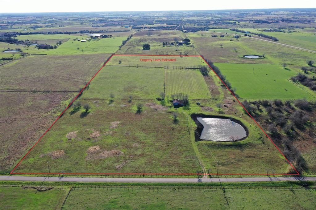 624 Dockal Road Fayetteville, Texas You can stop your search for the perfect site to build your country retreat! Reaching over 400’ in elevation, these beautiful 29.37 acres allow you to gaze for miles into Austin and Fayette Counties. This property has a pond stocked with Florida Bass, lush coastal pastures, perimeter and cross fencing, a barn, paved road frontage, and already has ag-exemption in place. The location is prime for anyone wanting the convenience of being near Round Top, Warrenton, and Fayetteville; yet, still have the peace and privacy you desire.