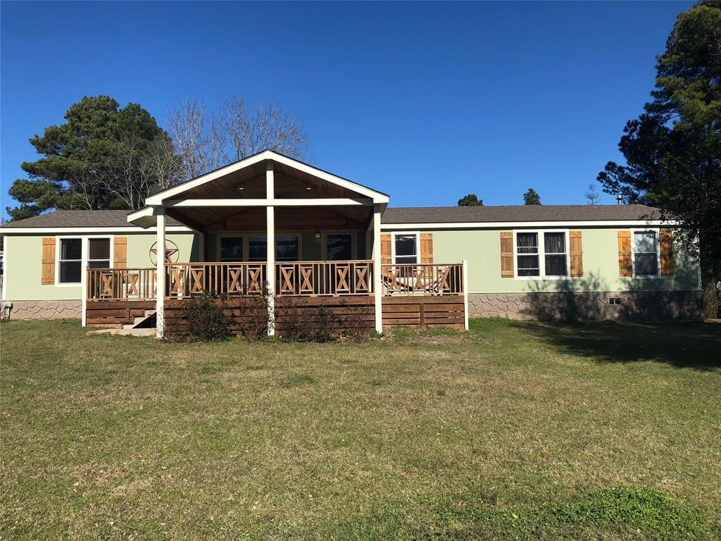 241 County Road 3404 Lovelady, Texas Wonderful property located in the Lovelady School District. This 2008 5 Bedroom 2 bath manufactured home offers over 2300 square feet of heating and cooling . This Double wide home has a huge living and dining room with Double Glass doors that step out to a huge covered back porch. This will lead you to the beautiful pond at the back of the property The kitchen boasts tons of cabinets and pantry with Island bar and a Gas Stove. The Master bedroom has double sinks,glamour tub, separate shower and walk in closet. The other 4 bedrooms are a nice size
with plenty of closet space! Plus large utility room. The outside has a front porch with ceiling fan and recessed lights to enjoy the peaceful outdoors. The property has its own water well and comes with a fully fenced 8.33 acres. This is a must see property!!