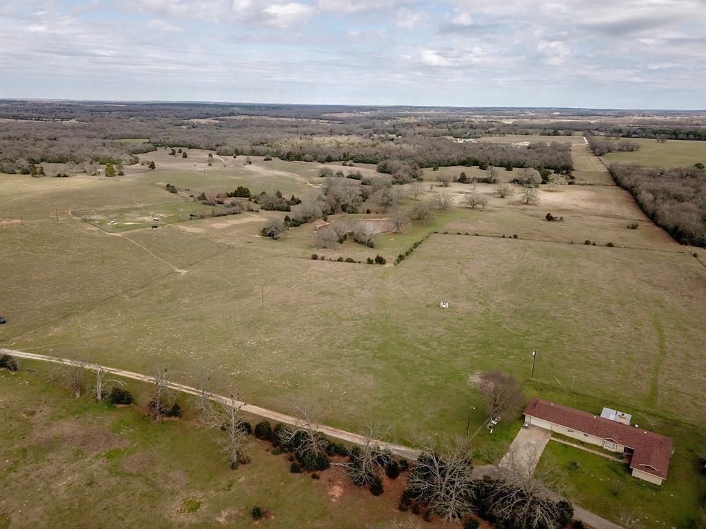 2899 CR 881 Marquez, Texas Exceptional one of a kind recreational ranch! Conveniently Located in Leon County Texas between Austin, Houston and Dallas/Ft Worth. This ranch features 3 bed 2 bath ranch style home, mature hardwoods, Improved grazing pastures, several ponds and lakes. The wildlife habitat is incredible consisting of very mature hardwood forest, oak flats, thick bedding areas, open grassland, Spring fed water creek, game trails, cut trails, duck slough, duck blind, game feeders, hunting blind. Property is loaded with trophy Whitetail Deer, Hogs, Ducks and all the Varmints that inhabit central Texas providing hunting opportunities all year long. County Road 881 dead ends into the property entrance. This is truly an out doors man’s dream property!!