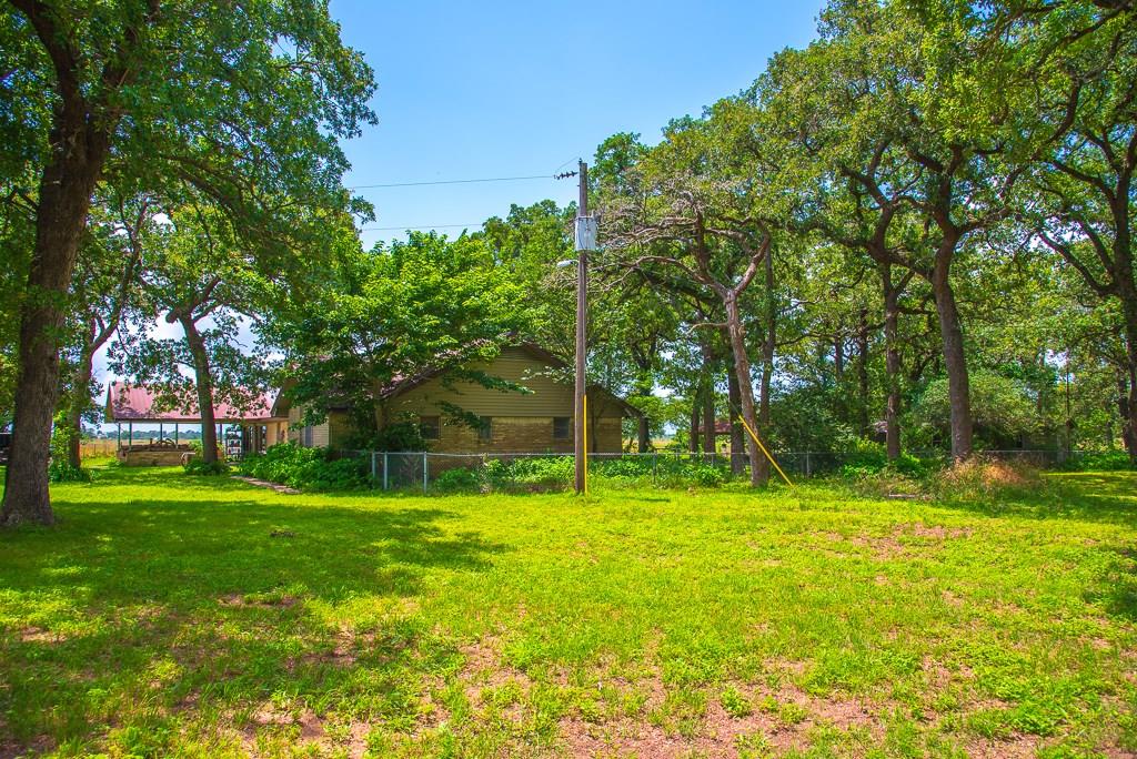1759 CR 402 Dime Box, Texas Wow Lovely home all you need to do is have a stay-cation with over 2500 Square feet, 4 bedrooms, 2.5 baths, a great room, full guest home, green house, storage shed, large 30x60 shop on concrete, 2 covered patios to enjoy your afternoon on, 3 septic tanks with gravel pad site for multiple rv parking. Brand new stainless steel stove-top and microwave. Renovated bathroom with huge walk in shower and granite sink top. Stained concrete flooring and even a wet bar! Move in ready. Dimebox ISD.