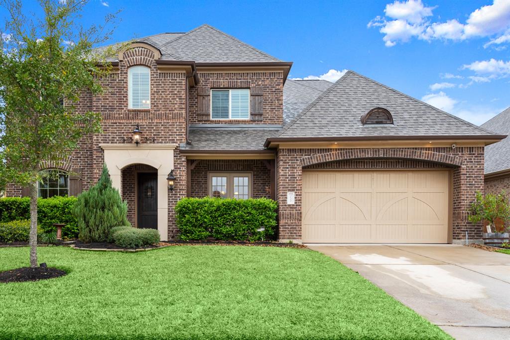 1022 Holly Chapple Drive Conroe, Texas Immaculate Brick Emerald home in Holly Chapple of Jacobs Reserve. This home shines with the pride of original homeowners. Features include handscraped against the grain hardwood floors throughout the first floor plus the staircase to 2nd floor, high ceilings & tall windows enhanced with plantation shutters, custom paint, exquisite light fixtures, upgraded Benedettini cabinetry throughout, whole house water softener w reverse osmosis, fully equipped media room, built-in spice racks banking the cooktop vent hood, Monogram appliances inc a built-in fridge plus 6 burner cooktop, surround sound, Pool & Spa by Northside Pools with a Katch-a-Kid net, sound panels in media room, 2 walk in attic rooms with custom storage shelving added, 3 car tandem garage, beautiful outdoor fireplace, French doors off dining room & so much more. All this plus zoned to The Woodlands Schools, close to all The Woodlands amenities & community banked by WG Jones State Forest.