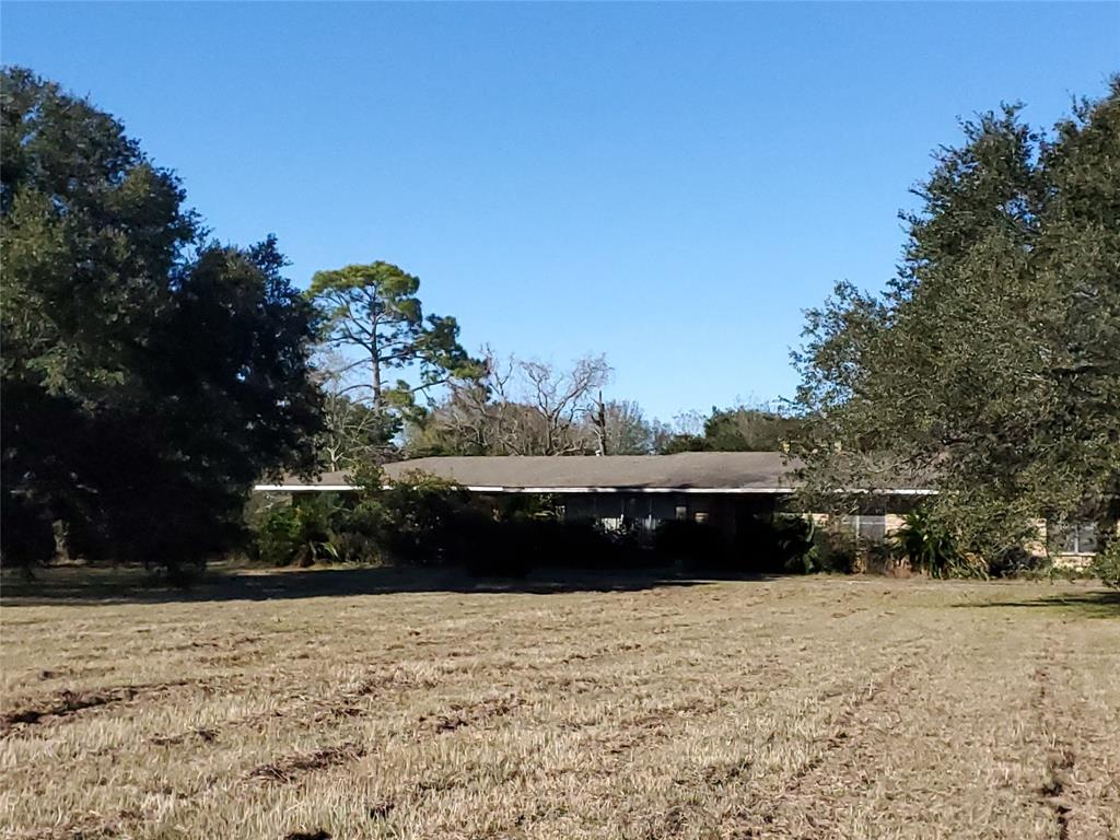 40018 Highway 290 Business Highway Waller, Texas Great Mid-Century Modern home on two tracts combined for a total of 4 acres, with 315' frontage on Hwy. 290 Business, also known as Hempstead Hwy. This extremely well-maintained home is in the classic Mid-Century Modern style with the original appliances, tile baths, hardwood cabinets, beautiful hardwood floors, and a huge woodburning fireplace. The home is in excellent shape and has GREAT bones. With just a little TLC this old beauty could be a showplace again and would make a perfect live/work location in an area slated for explosive growth within the next few years. Truly an excellent investment.