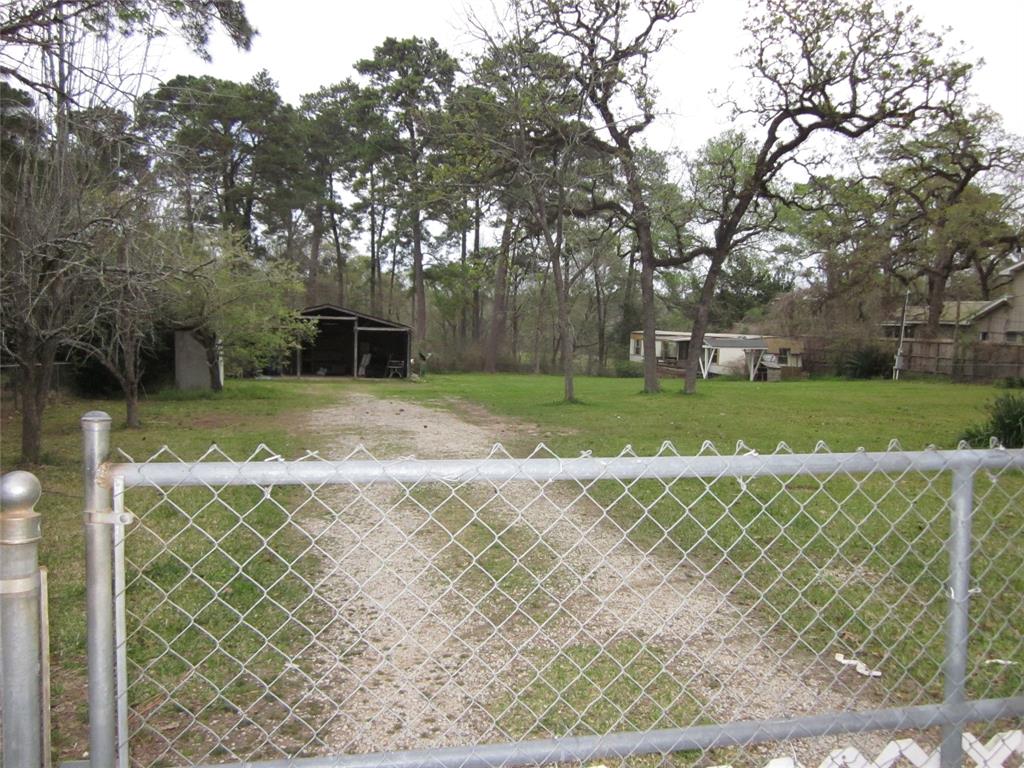 4018 E Mossy Oaks Road Spring, Texas Great piece of property! Would make a great office area! Can be a rental with a workshop, or two rentals. Unrestricted land with 1.3 acres of total fenced in up front of property. The rest of property is behind back fence line. Can handle 2 horses, dogs or cats. Can be used as a boat storage or RV etc. There is a single wide mobile home on property with 2 bedroom and 2 full baths. There is a carport that can handle 2 vehicles with a workshop off the back. Also has living quarters with a full kitchen, 1 bedroom and full bath. Water is free due to well.