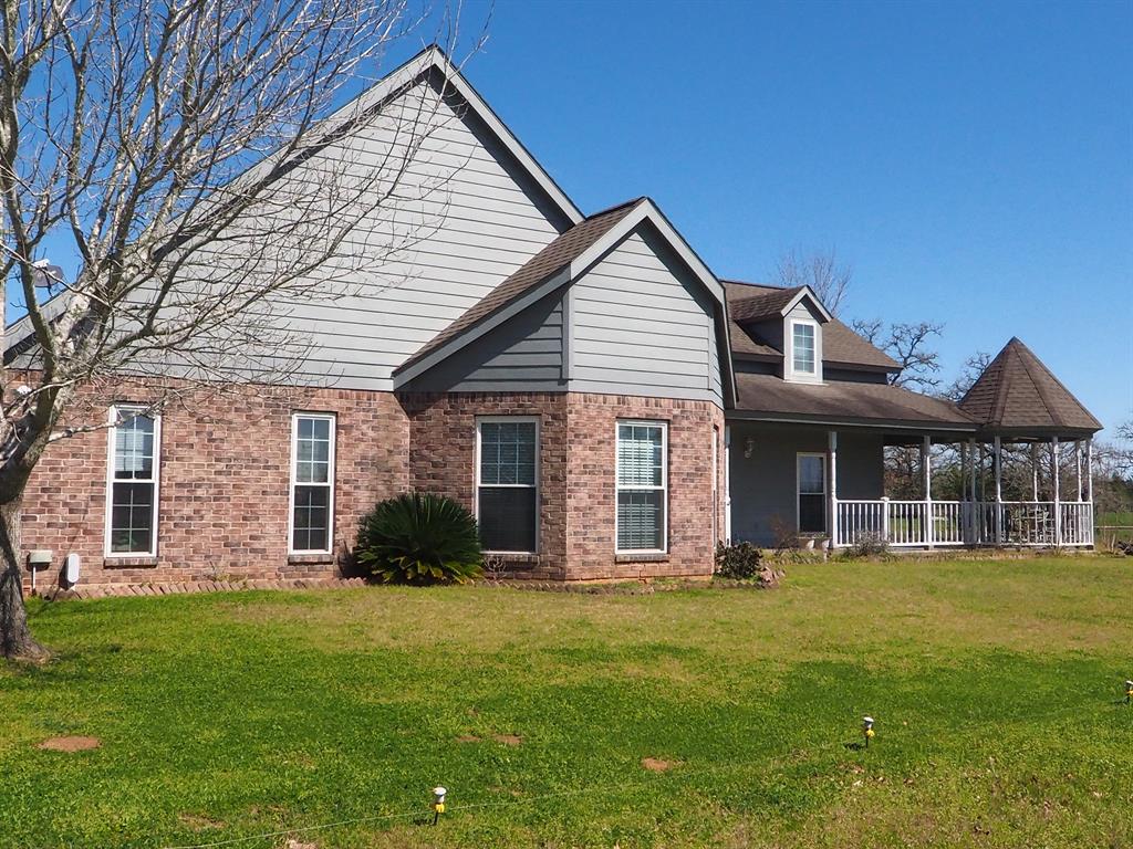 1051 S Farm to Market 1291 Fayetteville, Texas Come see this neat and clean brick home on almost 22 acres with just the right amount of trees and a nice sized pond. The home is bright and inviting with large double-paned windows, open living area with vaulted ceiling and sliding doors to the back deck. The kitchen features custom Encore oak cabinets, a gas cooktop, double ovens, and tile back splash. The master suite has a large walk-in closet, tiled walk-in shower and double vanities. Includes a 20'x30' workshop with a concrete floor and electricity. Easy living in the country that's just 5 minutes from Fayetteville, 20 minutes from Round Top, and 90 minutes from Houston.