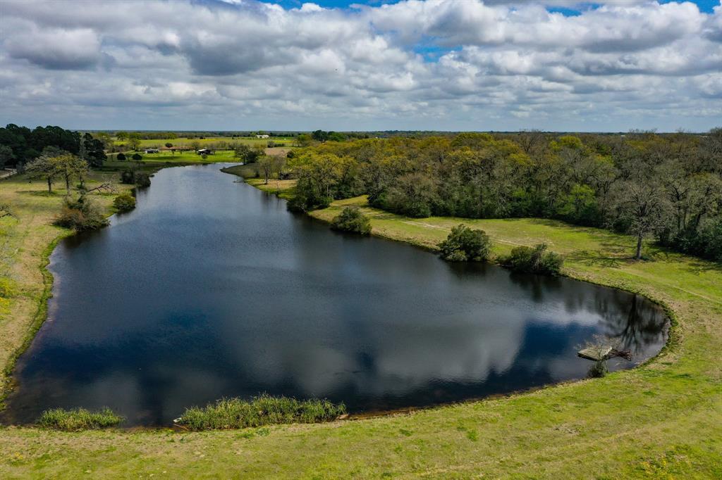 5289 Greenbriar Road Madisonville, Texas Pretty and well maintained ranch. Features recently updated large ranch home, large shop/barn, and a beautiful 8 acre spring fed fishing lake. The property is mostly open improved pasture land with areas of woods for wildlife. Nice location just north of Madisonville and west of I-45. Land is fenced and cross fenced. Good sandy loam soil type, creek traverses the ranch. Perfect for a permanent residence/ranch or a weekend getaway with recreational aspects. Madisonville offers retail opportunities, medical facilities and good schools. Come Enjoy the Good Life!!