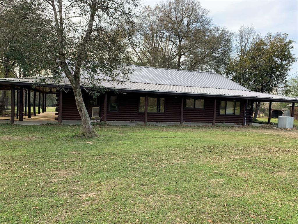 1201 Lee Turner Road Cleveland, Texas Custom Log home situated on 40 beautiful acres with gentle rolling hills. Spring fed creek with lots of fish. Trophy deer, with property set in Sam Houston National Forest. Property is cross fenced for horses or cattle. 30 minutes to The Woodlands and 50 minutes to downtown Houston. Property is surrounded by privately owned acreage. Gorgeous log cabin with wrap around porch. Beautiful claw foot tubs, Viking range, large island with granite, and custom hard wood floors.