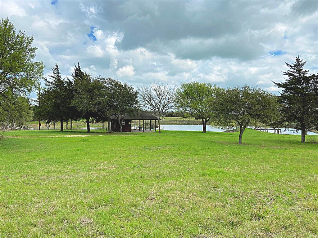 1221 SH 237 Burton, Texas 47.797 ac on HWY 237 only a few minutes from Round Top. This rolling tract has scattered live oaks and a private driveway offering great seclusion, has two large lakes stocked with bass and catfish AND a lovely hillside homesite with VIEWS. Enjoy this country getaway in a prime location about halfway between Round Top and Burton two of the most sought after historic villages in Texas. Antique and cultural festivals in Round Top, the Historic Texas Cotton Gin Museum and festival in Burton along with many country restaurants and taverns with live music and great dining. Furnished with a picnic pavilion and storage shop, perimeter fenced, pier and electric service on site. Has a current wildlife exemption. Good grass cover and abundant wildflowers. “DEED RESTRICTED” NO COMMERCIAL USE, PROPERTY TO BE USED FOR SINGLE FAMILY RESIDENTIAL, AGRICULTURAL OR WILDLIFE USE ONLY” NO MANUFACTURED/MOBILE HOMES OR TRAILER CAMPERS. Seller to keep all minerals and waive surface rights per future leases.
