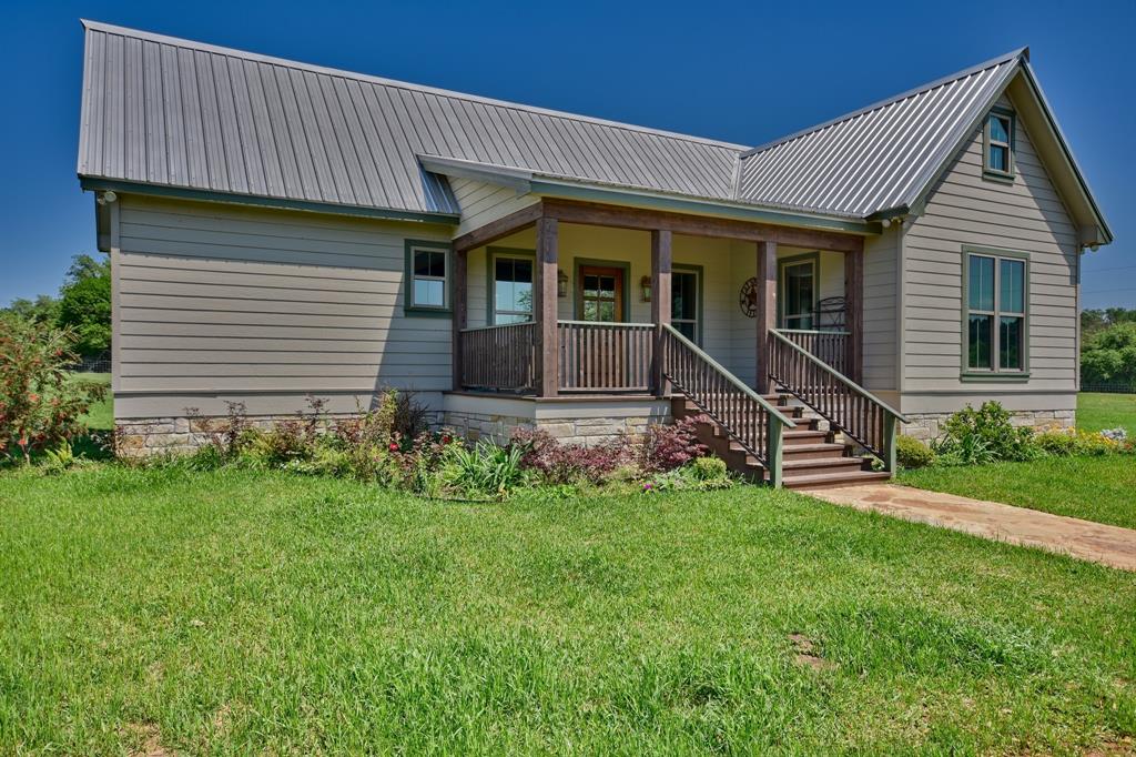 13792 Fm 1094 Austin, Texas Wonderful recent construction in the country setting in sought after Cat Spring! This absolutely charming 2 bdrm/2 bath sits on 3.12 acres with grand old oaks/lovely grounds completely fenced (5') and the front of the property is lined by an attractive country black wood fencing and inviting entrance. Floor plan is light and open w/high beamed ceilings/loft over kitchen/Beautiful granite counters w/brick backsplash/deep double sinks/high inset lighting/sit up breakfast bar/double pane windows/gleaming wood flooring/2nd bedroom leads out to a wonderful railed decking where county sunsets are AWESOME and summer BBQ gatherings are certain! An Outstanding 7 bay building with full office/4 bays open/3 bays enclosed w/sliding doors is a perfect "work from home" setting for whatever occupation you may be in. This property is cleared/Have a great country, (very recent built) week-end get away...or continue to build and expand! 30 miles from Katy, or Brenham, or Austin! Aerial views coming!