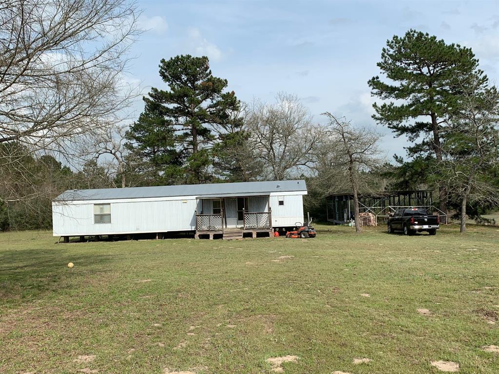 9724 Highway 7 East Centerville, Texas This property is beautifully manicured mature woods and is mostly fenced. There is an extremely immaculate 2 bedroom, 2 bath mobile home with comes completely furnished. It has community water meter and septic.