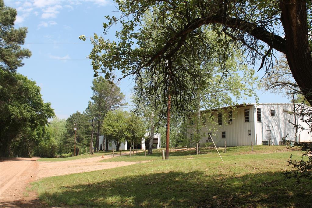 7312 Palm Road Sealy, Texas If you are looking for a property to live and have your business, look at this one. There is a two story office section of one of the metal buildings that could easily be converted to living space. It has a bathroom, hook up for laundry, septic, water, electric and window units, in addition to a large shop area all under one roof. In addition, there are two other metal buildings that could easily be fitted to accommodate most any type of business. The 6 unrestricted acres has areas of open land, scattered woods and heavily wooded areas down a quiet dead end gravel road for privacy and seclusion within 5 miles of Bellville, TX. Cat Spring Creek is a boundary and is a live creek with crystal clear water and has only been dry one time since the current owner has purchased the property. This property is located between Cat Spring and Bellville, TX. There is a small animal shelter with pens that would be perfect for a 4-H project.