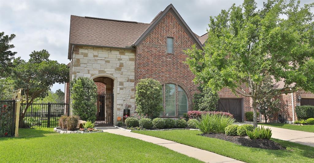 1206 Maroon Lane Houston, Texas Stunning 4/5 bedroom 4 1/2 bath 3 car garage right on the lake right in the heart of energy corridor! Prestigious Darling home with beautiful architectural touches throughout. Gleaming hardwoods,custom lighting and plantation shutters make this elegant home shine! Living, kitchen, breakfast and sitting area all overlook glistening lake. This open and airy floorplan has so much flexibility to suit everyone's needs. Large family room and gourmet kitchen is perfect for entertaining. Recent interior paint. Lovely master suite has private sitting area with covered porch overlooking lake. Tranquil and spa like master bath is equipped with oversized soaking tub and spacious walk in shower. Upstairs bedrooms are all generously sized with walk in closets. Game room/media room is the perfect spot upstairs for family time. So many relaxing areas in the lovely landscaped side and backyard with gate leading out to lake area and walking trails. Great location for this peaceful gated community!