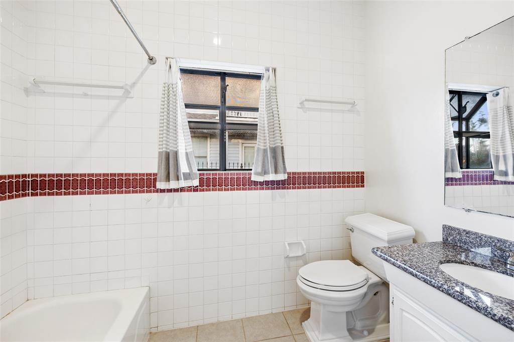 One of two bathrooms with shower/tub combo