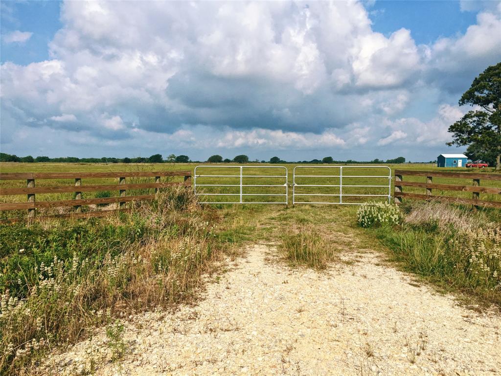 Hwy 71 Midfield, Texas 26.68 acre hay meadow for sale. Land has been leveled and Jiggs Bermudagrass has been established. Owner has utilized the land as a working hay meadow. The property is completely fenced with net wire to the North and barbed wire surrounding the other sides of the property. Oak trees are located at the far West side of the property. Pine trees are located at the North East corner of the property.