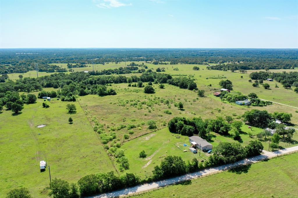 6169 New Road North Zulch, Texas Beautiful, Secluded Acreage in West Madison County with quick access to Hwy 21 and approximately 30 minutes from Bryan/College Station. This 28+/- acreage track is just right for hunting, fishing and agriculture being about 50% open/50% wooded. Features include large established trees, fence, spring fed pond, an implement shed, and access to electricity. Previously used for hunting and grazing agriculture, this property has some nice building sites and is unrestricted if you want to add a mobile home. There is an agriculture exemption already in place and possible access to rural water. Make this your new homesite or weekend retreat for making lasting memories family and friends.