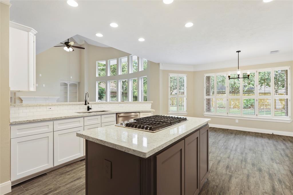 Bring out your inner gourmet in this beautiful newly remodeled kitchen featuring high end Kitchen Aid stainless steel appliances, luxurious quartz countertops, undermount split stainless steel sink, LED lighting and soft close shaker style cabinets and drawers!