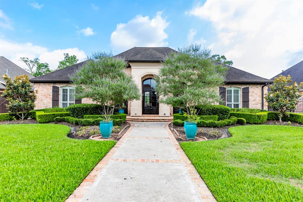 4230 Brownstone Drive Beaumont, Texas Gorgeous home located in the sought after West End of Beaumont. Sits on .31 acres in a charming neighborhood with luscious landscaping. From the elegant crown molding to the in-ground pool, it is all in the details with this property. Natural light pours in through several windows with plantation shutters. High ceilings and neutral paint colors that compliment the warm wood floors. Stunning wood-burning fireplace and built-in bookcases. Kitchen comes complete custom cabinets, double ovens, granite counter-tops, breakfast bar, and an island with a cook-top. Spacious master suite with a garden tub and separate shower. Retreat the backyard and sit under the covered patio with outdoor fans or soak up the sun by the pool. This home is a must see!
