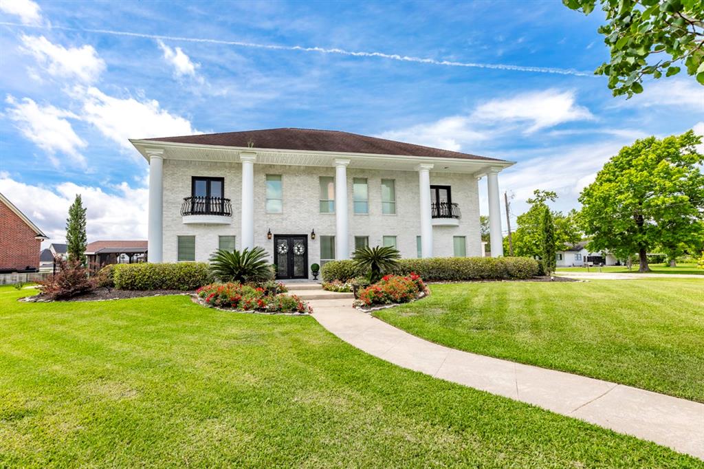 1000 Dalton Street Bridge City, Texas Custom luxury home on the water invites buyers into elegant entertaining and life well lived. Delight in summer days relaxing by the pool with a water slide and waterfalls or in the screened outdoor bar & kitchen with fire pits and a fireplace. Enjoy the water right in your backyard with over 100' of bulkhead, boat access, and a jet-ski lift. The interior is a dream with soaring ceilings, arched doorways, brick accents, crown molding, granite countertops, custom cabinets, and top of the line appliances. Gather friends and family in your own private theater with fabulous leather seating. Enjoy the view of the sun setting on the water from one of the 2 balconies. This property is a dream!