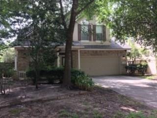 18 Dalea Place Spring, Texas Tile in Wet areas, Large Master Bedroom and Bath Downstairs, Game Room up, Formals, Fireplace, Cul-De-Sac Street, Covered Front and Back Patio, Sprinkler System, Large Utility Room inside, Double Driveway, Refrigerator.Move in Ready