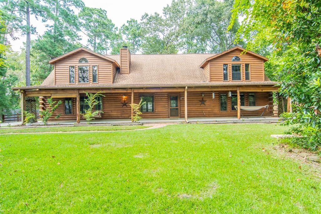 11921 Silver Leaf Lane Conroe, Texas This home is a must see, Seriously..!! Very RARE one of the kind and very hard to find a cozy two story custom built log home, spacious living area and is in a quiet neighborhood. Conveniently located near I45 and The Woodlands Mall, restaurants and entertainment. Secluded on a cul-de-sac sitting on almost 1 full acre lot with possibility add on pool in the future, outdoor kitchen and kids playground in own backyard. Distinctive floor plan offers it all. With a large covered front porch, stone fireplace that reaches the ceiling, a spacious loft area, country kitchen, large size bedrooms, sprinkler system, Tankless H2o Heater, water softener and water fountain. Come enjoy the tranquil privacy of country living while being only minute away from the many amenities The Woodlands offers. Don't miss out a chance to own this custom built log home, Call your agent for showing and see if this is right fit for you and your family. NO FLOODING!