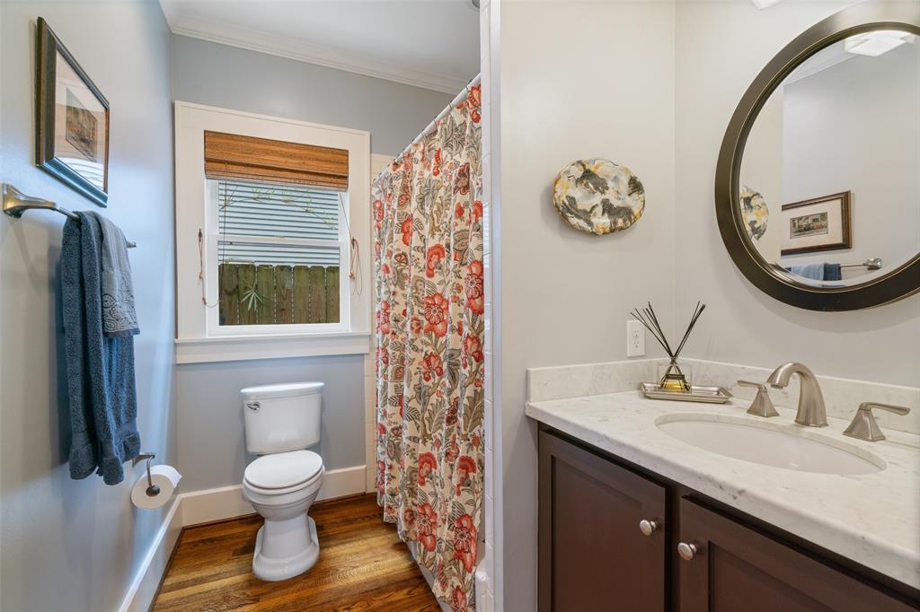 This downstairs guest bathroom in located on the 1st floor and includes a tub/shower combo and a gorgeous marble vanity.