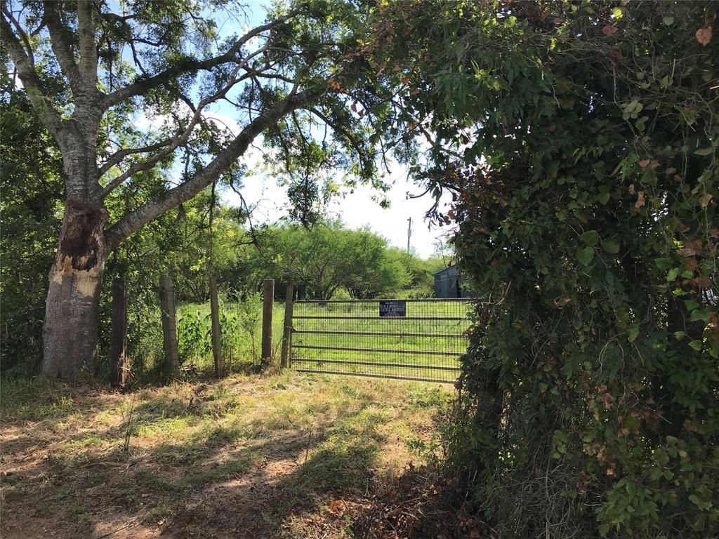 1098 Jackson Road Bellville, Texas This 50.091 acres tract is being sold out of a 95.14 acre tract. UNRESTRICTED & AG EXEMPT. Improvements include two barns and an older 1984 mobile home. The smaller barn is 870 sq ft; the other consists of 4000 sq ft; built in 2004. In addition, the seller will convey the Mahindra tractor, trailer and other implements including the front and loader, mower and scrapper. Barb wire fencing; gate.