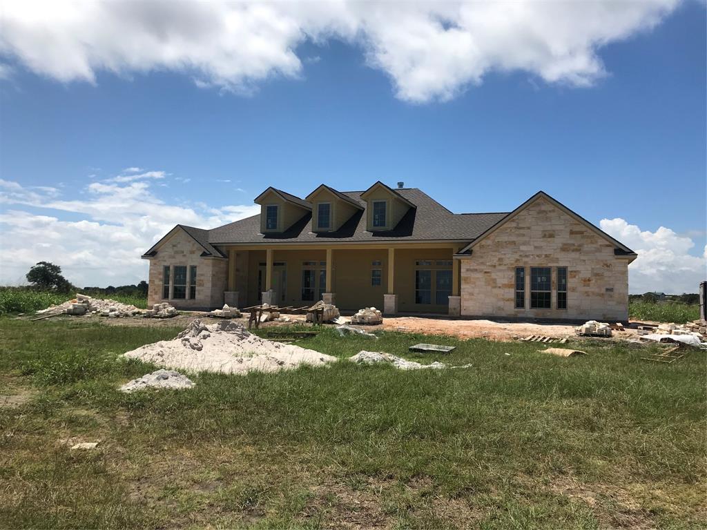 9887 Loop Road Bellville, Texas Ready to make the move to the country? Set halfway between Bellville and Chappell Hill, this amazing gem in Buckhorn Loop Road Estates is perfect for someone who wants to leave the hustle and bustle of the city but keep the amenities of a new, modern home! This home sits high and dry on a hill overlooking the beautiful rolling hills of Austin County. Offering a highly liveable 2783 sq. ft. of conditioned space with 3 bedrooms, a study, 2 ½ bathrooms, a dining area and an open kitchen into the family room, you will be right at home. All the cabinets are custom built, the closets are spacious and the home has 3 large porches that equal right at 700 sq. ft. of covered shade from 3 different sides of the home. It also is highly energy efficient with open cell spray foam throughout, and a 4 ton 17seer Trane HVAC system. Located in the highly desirable Bellville School District. Call me for more details!