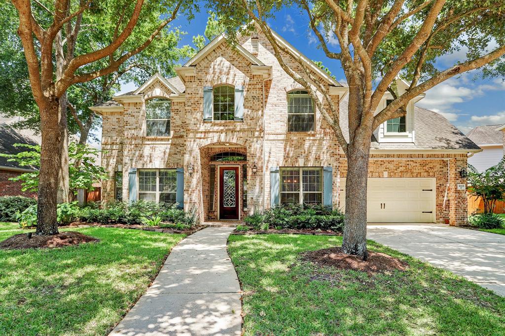 31115 Lakeview Bend Lane Spring, Texas This exquisite home situated in a rare gated section in Imperial Oaks boasts a stately elevation with front yard view of the lake, fabulous outdoor living, lofty ceilings, hardwood floors, lovely finishes, superb open floor plan, handsome study, elegant formal dining, 3-car tandem garage and lots of storage. Amazing island kitchen features stainless-steel appliances, abundant cabinetry, 5-burner gas cooktop & sizable pantry. Kitchen seamlessly flows into breakfast nook and spacious living area with gas fireplace, built-ins and huge windows that flood the room with natural light. Master suite offers tray ceiling, dual sinks, vanity area, walk-in closet, and tub with separate shower. Upstairs provides 3 sizable bedrooms with walk-in closets, 2 full baths and spacious game room & flex space-great for entertaining! Backyard boasts a large covered patio with remarkable ceiling, cable connections, wood-burning fireplace, and ample room to run and play. Zoned to exemplary Conroe ISD!