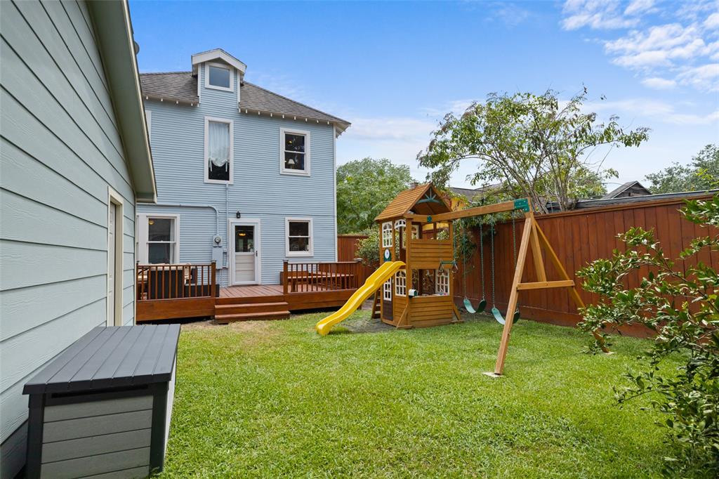 The generous fully fenced backyard includes wood porch and tons of space for the kids or dogs to run around.