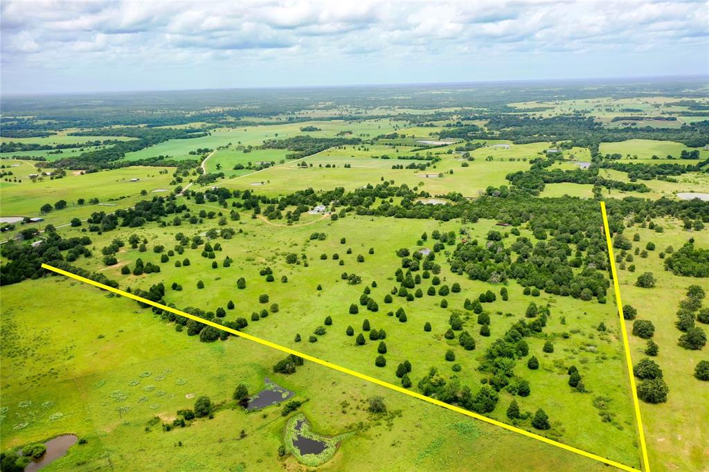 TBD County Road 107 Lincoln, Texas Rare find between Paige and Lincoln! Gorgeous rolling acreage with ponds, trees, clearings and views within an hour of Austin and College Station, only 24 minutes to Bastrop. Perfect for your beautiful new country homesite! Ag exempt for low taxes, county water available at street, electricity on adjacent properties, septic needed. Restricted against mobile and manufactured homes; ask for details about seller-imposed restrictions.