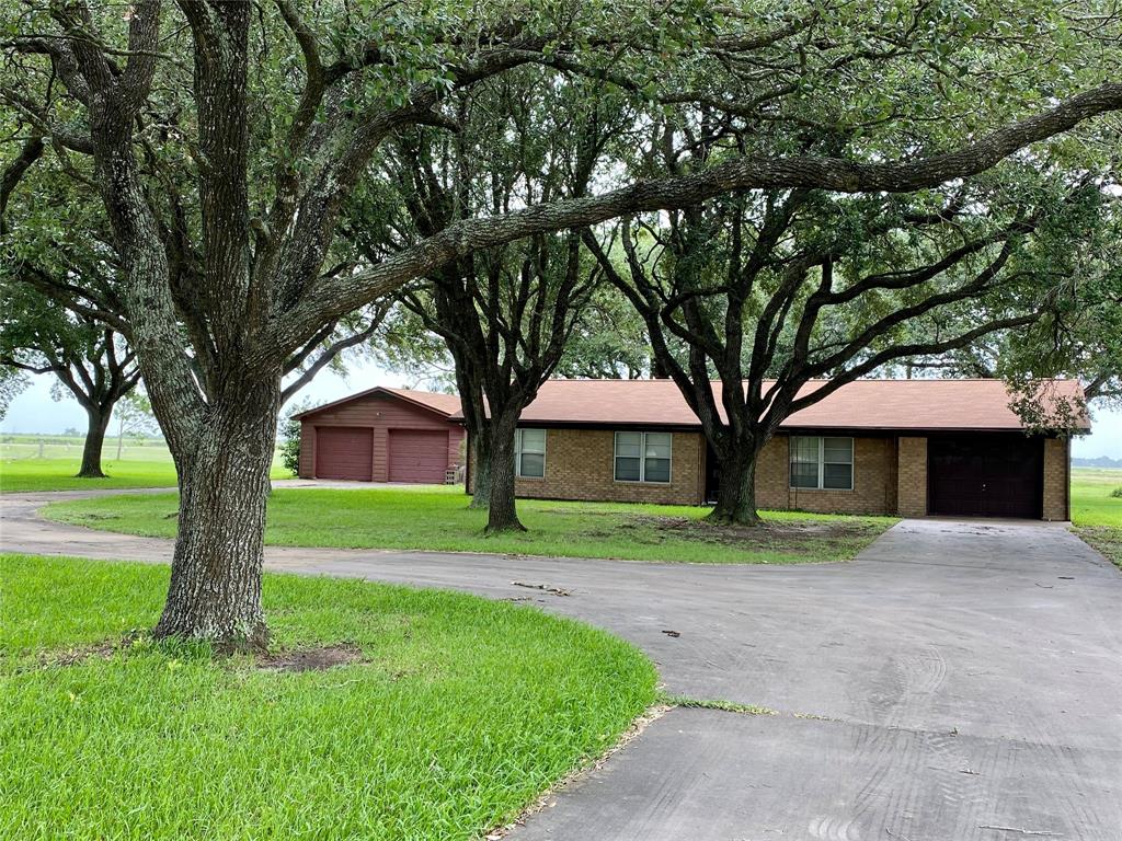 12006 State Highway 60 Bay City, Texas Located just minutes outside of Bay City on 1 ACRE! This well maintained brick home offers an open concept living, kitchen, & dining space. Features wood cabinets, ample natural lighting, & double pane windows throughout. Master bedroom with attached bathroom has a shower- guest bathroom has a tub/shower. Covered back patio overlooks the neighboring grass farm. Oversized 1 car attached garage plus a 2 car detached garage. Yard is well shaded. Has a new roof & more! Less than 10 minutes to downtown Bay City and only a 10 minute drive to Matagorda and all it has to offer! Being sold as-is. No seller's disclosure (estate). Built in 1971 per seller. New roof Dec. 2017 with WPI8 certificate on file. Foundation leveled by Juarez in 2009. New septic 2009. New water heater 2011. Water well operates the sprinkler system only. Water for home is provided by the City of Wadsworth. Room dimensions are approximate.
