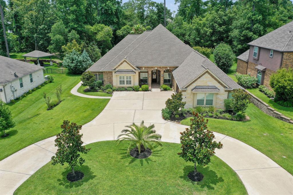 5591 Bright Timber Landing Drive Spring, Texas Beautiful well kept one story home in the prestigious Benders Landing Estates. Custom pool and spa with pebble tech finish, tanning ledge, weeping water falls, gas and fire bowls. This home has it all with vaulted ceilings, crown molding, 2 fireplaces, study with engineered hardwood floors, stainless steel appliances, granite counter tops, and built in custom cabinets in the family room. The spacious formal living room looks out onto to the pool. Extra large master suite with a sitting area and a door to your oasis. Covered patio, outdoor kitchen, and pool are all the things you need to entertain your family and friends. Electric panel is wired for home generator with external plug-in access. Extra storage in garage. If location is what you need this home is close to I-99, Hardy Toll Rd, and I-45, Exxon campus, IAH airport. Access to the clubhouse, pool, gym, tennis courts and much more. Highly acclaimed Conroe ISD and zoned to the new Grand Oaks High School. Low taxes and no septic.