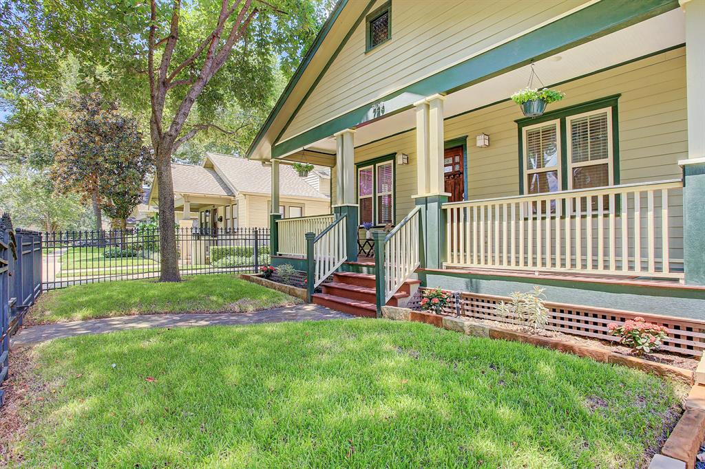 The front porch runs the length of the home with lots of room for seating areas.
