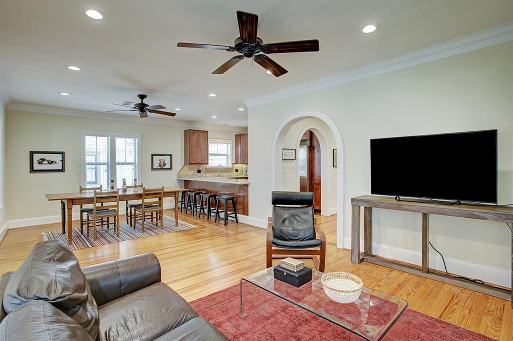 The living, dining and kitchen areas are spacious, connected and bright.  The kitchen breakfast bar is counter height and comfortably fits at least four bar stools.