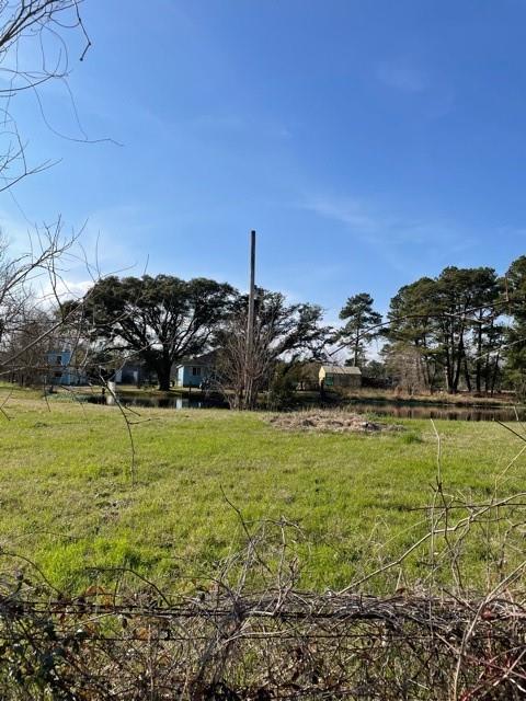 10608 S 94 Highway Trinity, Texas Come to the farm! Bring your horses, cows and chickens if you want... Beautiful pastures, mostly fenced and cross fenced, large barn with workshop, implement storage, extra get-away room, office, POND, etc. Also, includes large greenhouse, large covered OUTDOOR KITCHEN, etc. Come and see!