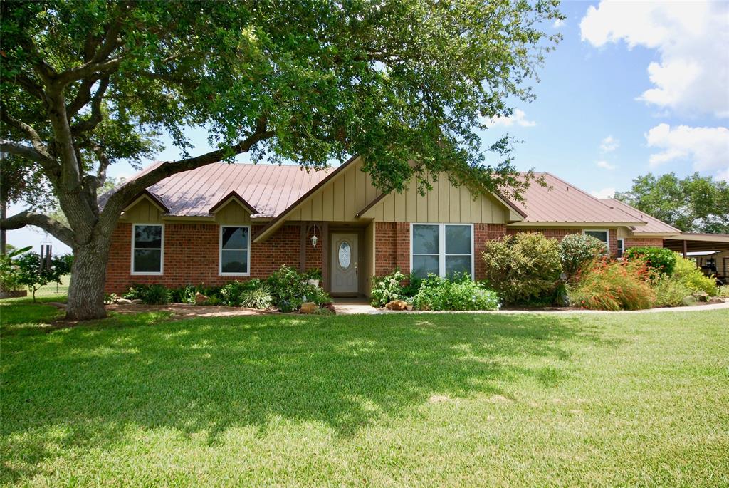 5716 Fm 1295 Moulton, Texas Beautiful, well maintained property just north of Komensky. 10.5 acres, 2 bedroom, 2 bath with an office, this property has a 1,682 SF shop, wonderful views of the country side, and an immaculate yard! Improved pasture, with a gated entrance, this home has easy access to US 90 and I-10. The brick ranch style house sits on top of a small hill and provides privacy and tranquility. The office could easily be turned into a 3rd bedroom. The large back porch and mature trees provide shade, the shop and storage building provide ample room for storage and equipment. The home boasts a huge mud/laundry room, great living area, large master bedroom, and the 2nd bedroom has a large walk in closet. Properties like this, in this area, are few and far between. Don't miss your opportunity for a turn key ranchette in Lavaca County!