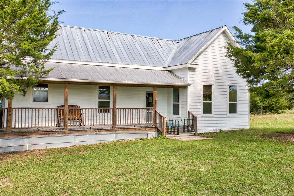 1156 Private Rd 5012 Ledbetter, Texas Peaceful retreat for the entertainer, romantic, hunter, or outdoors lover. The quaint partially furnished 2 bed 1 bath farmhouse flaunts beadboard walls and ceilings, original fixtures, doors, and hardwood floors. Outside is over 1,250 sq ft of attached porch/patio space with ceiling fans, a mounted TV, refrigerator, fire pit over looking the pond.
Red metal barn (2009) 1,200 sq ft has 3 roll up doors and over sized entry door with a large loft, entertaining area with a pool table, work area, equipment storage.
When not entertaining, choose from fishing the 1 acre pond stocked with Largemouth Bass and Bluegill, Sporting clays, exploring, bird watching, star gazing, hunting, or admiring sunsets at the "Sunset Spot" on the bluff.
Updates- Hardi-plank siding, double panel vinyl windows, central HVAC.
3 mi to Nails Creek State Park, Lake Somerville
9 mi to Burton
20 mi to Round Top & Bi-Annual Antique Show
1 hr to Austin or College Station
1.5 hr to W. Houston Energy Corridor