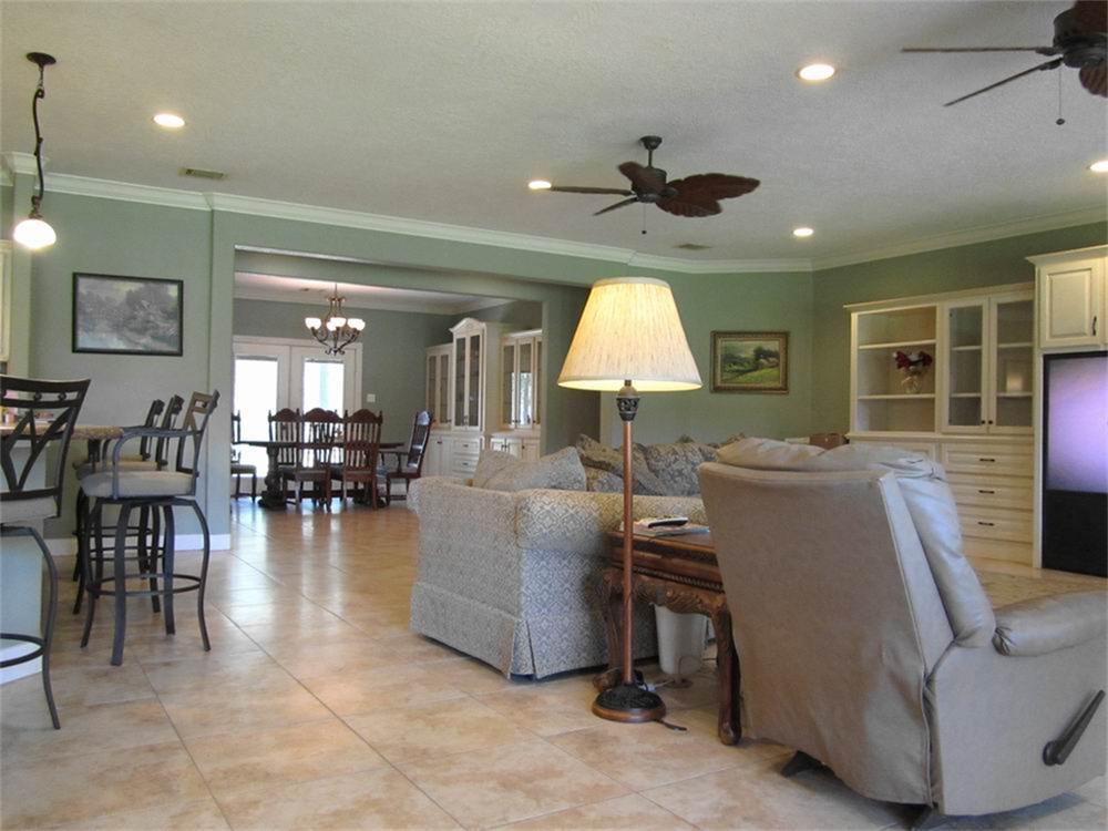 7883 FM 1725 Cleveland, Texas COMING SOON!Country Dream Paradise!! - Custom Built Home and 4+ Ac Lake nestled on 18.2887 Ac with beautiful natural landscape. The property is in San Jacinto County on FM 1725, just N of Bear Creek. This spacious 3646 SF home has three bedrooms, 2 Full Baths/2 1/2 Baths, w/ large open living and kitchen area. The features include: Travertine flooring, Custom Built Cabinetry in Living Area, formal Dining Room, Study, and Laundry room. The Gourmet Chef's Kitchen opens up into the Living area with a wrap around 6 seating Breakfast Bar. The kitchen includes Custom Cabinets, Granite Counter Tops, Island w/Cook top and modern appliances. Master Bedroom is 18x19' w/Crown Molding and Decor Recessed Lighting. Master Bathroom features his/her sinks w/Granite counters, WP Garden Tub, Tile Walk-in Shower, and large walk-in closet w/ built-ins. Relax in Game Room w/full bar or snuggle up with a book from the built-in bookcase. The workshop has built in cabinets w/large carport w/18x20 storage.