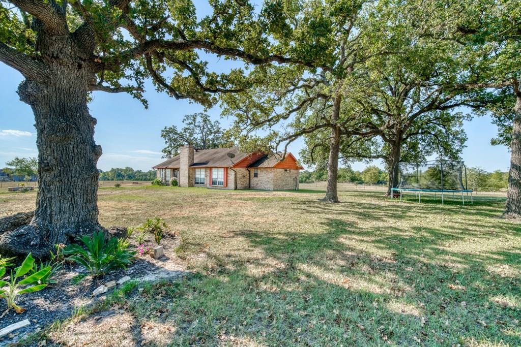 24330 County Road 115 Bedias, Texas Looking for the perfect spot in the country, this place is it! Located just 100 miles north of Houston, this 45 acre property is perfect for hunting deer and hogs, fishing with the family, a place to raise a few cattle, perfect for horses, or improved pasture for cutting hay. The 3 bedroom, 2 bathroom brick home overlooks one of the water sources on the property. The home has a garden tub in the master bath and double closets, 2 beautiful bay windows, and a fireplace in the den. There is also a 40x50 shop on a slab. Whether you are looking for a weekend getaway or a place to call home, this property certainly has potential.