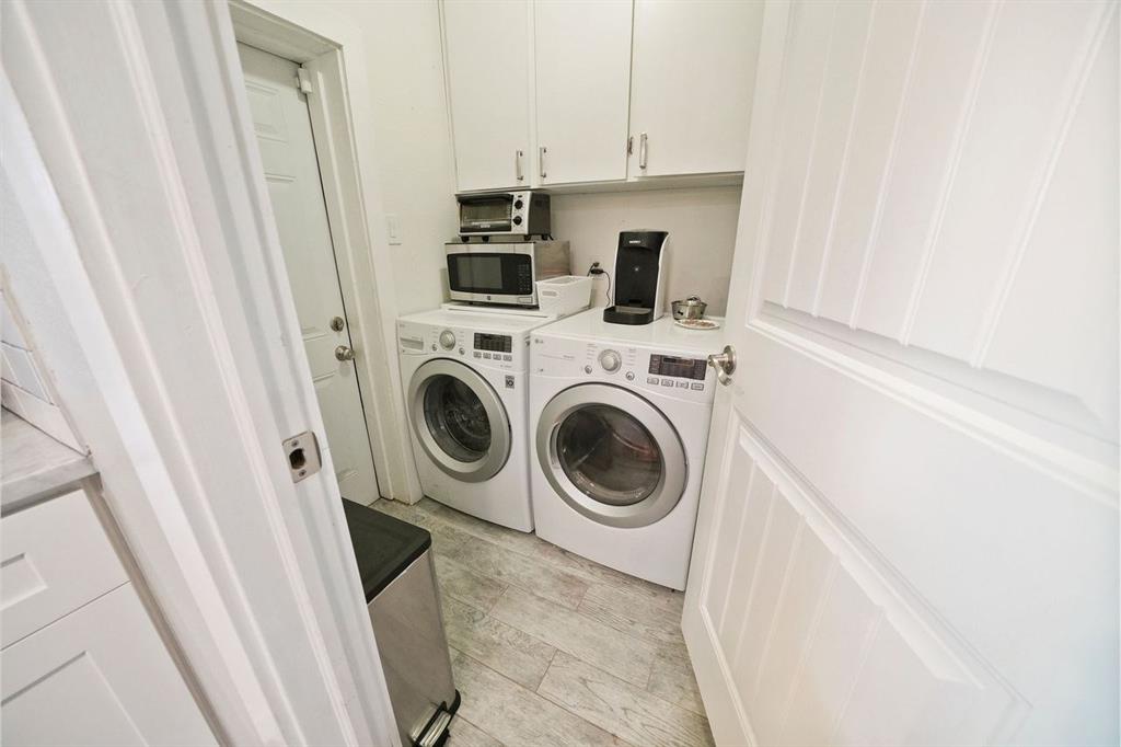 The in-home utility room provides access to both the backyard and the garage.