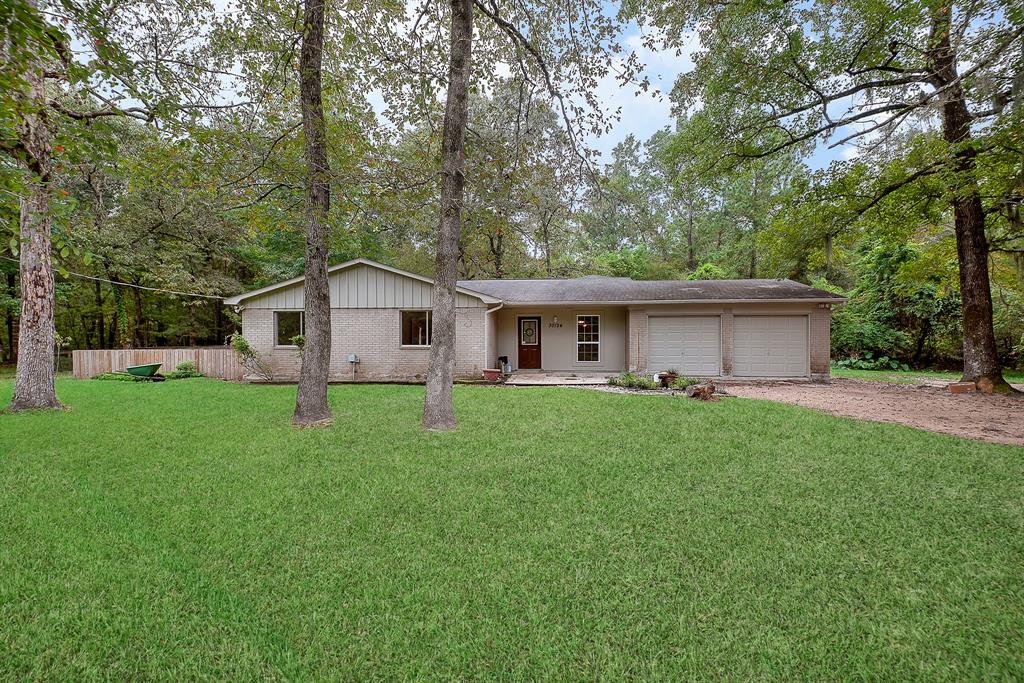30124 Oak Lane Magnolia, Texas UNRESTRICED acreage property for rent. Bring your animals, business & vehicles. Total privacy on about 9 acres conveniently located minutes from Woodlands Parkway & FM2978. Fresh paint and new carpet. Enjoy nature from the sunroom. Property also has a pond and creek. Plenty of space for RV parking, boat parking & business vehicles. Partially fenced for dogs. Secluded location very private and quiet.