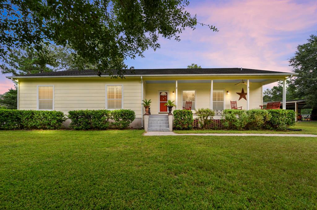 9675 Plum Grove Road Cleveland, Texas Peace and quiet awaits! Take a look at this working cattle farm on 25 acres, fully cross fenced, tucked away surrounded by mature trees, including apple, pear, peach, and a variety of grapes. Step inside the home from your covered front porch and you will find hard wood floors throughout the main living areas, the bedrooms have plenty of natural light. The kitchen is large with ample amounts of space for cooking, canning or whatever your culinary dreams are, you can do it right here. There is a sun room off the kitchen as well as a covered back porch. If you would like, you can head out to the out door fireplace and relax outside with a cool drink and watch your chickens and cows in the sunset. This is a MUST see!