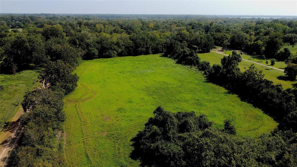 County Rd 151 Boling, Texas Beautiful unrestricted land, just over 14 acres, located in Boling, TX. Land is partially wooded in the front, and in the back, with a clearing in the middle of the property that is accessible from CR 151. Property has frontage along FM 442, and backs to the San Bernard River. Two separate Tax IDs, each tract is 7.14 acres (appraisal district). SELLERS TO RETAIN ALL MINERAL RIGHTS. Property DID flood during Harvey.