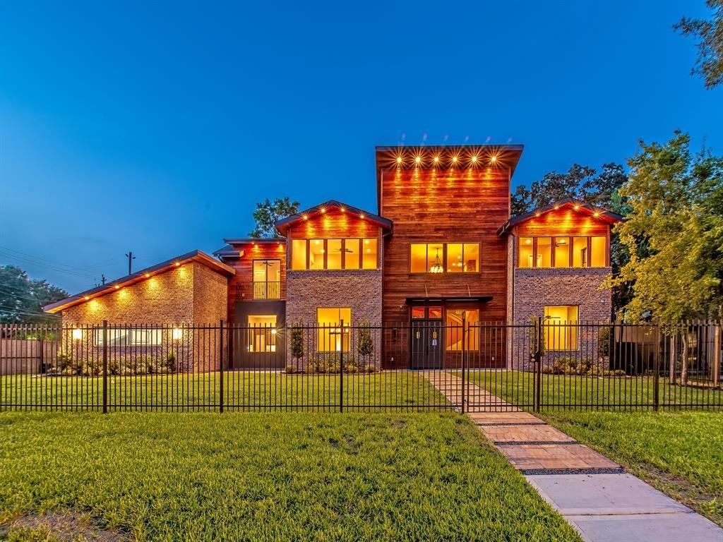 3803 South Macgregor Way Houston, Texas Stunning old world design meets luxe new age tactical execution in one home. This custom home brings both worlds together in stunning fashion. The residence features a full Tiger Wood facade imported from Africa, massive chef's kitchen, dedicated wine room with a 9-ft glass wall, a full outdoor kitchen with exterior wood burning fireplace, an elegant white tiger runner, and custom ironwork with Creole touches. No stone has been left unturned: interactive mirrors, a hidden safe, a live edge acacia table, and bench from Arka Designs is to stay with the home, security cameras to stay, as well as brand new Roman Shades and drapes, tons of " 3-D" walls finished with brick and tile. Minutes from the medical center, downtown, and the Galleria. The 3rd Ward/Medical Center community offers something many communities do not: a rare chance to become a part of the fabric of the community and build lifelong professional and personal relationships.