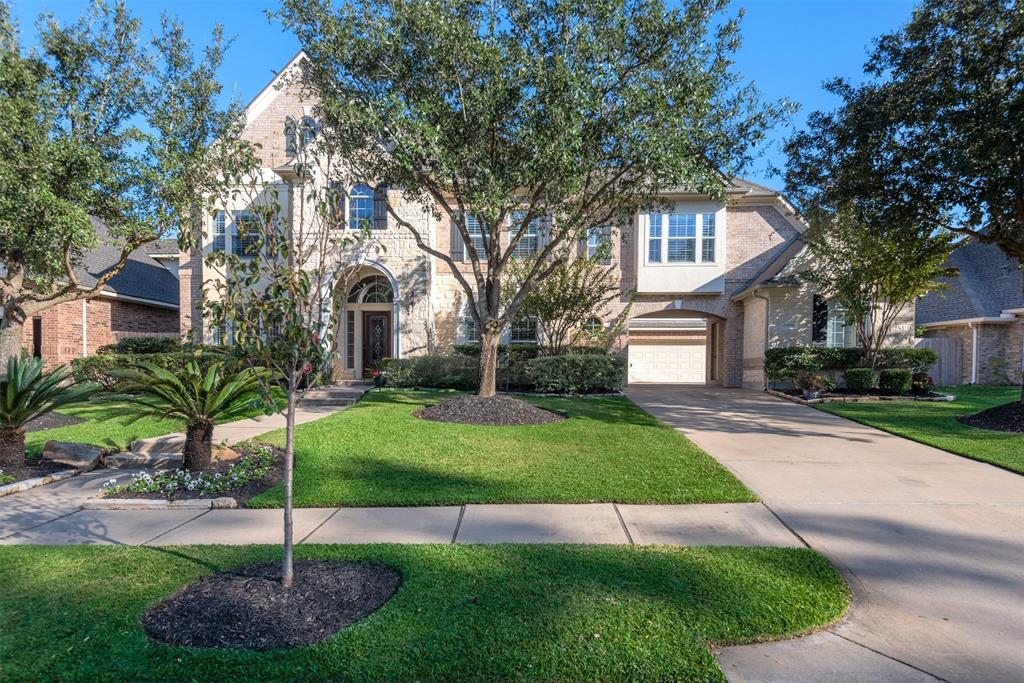 20810 Windrose Bend Drive Spring, Texas This fabulous 5-bdrm Newmark home offers the charm of living in the desirable Eagle Lake section of Windrose! An impressive brick and stone elevation with 3-car garage & porte-cochère set this home apart! Traditional beauty and open floorplan throughout. An inviting 2-story foyer w/winding staircase is adjoined by a Formal dining RM w/custom buffet and handsome study w/wrap-around bookshelves. Family RM features a stone fireplace surrounded by built-ins and expansive windows overlooking the backyard. Gourmet kitchen w/granite, island and bar seating, gas cooktop, butler’s pantry, walk-in pantry, under cabinet lighting & designer glass cabinets. Primary bath offers dual vanities w/recent marble countertops, frameless shower & jacuzzi tub. Game RM, media RM + 4-bdrms up! Recent granite in secondary baths, recent carpet, radiant barrier, sprinkler system, security system & more! Convenient to Grand Parkway, I-45, shopping & dining. Acclaimed Klein ISD!