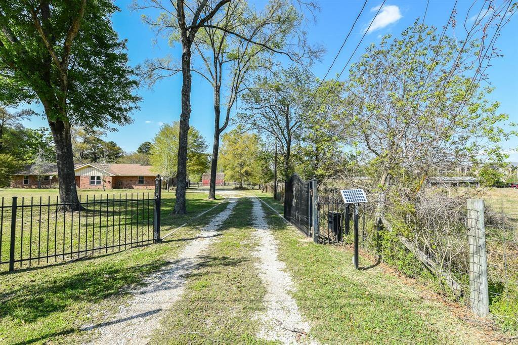 8710 West ln Magnolia, Texas Great Location! 1.5 acres UNRESTRICED Commercial and/or Family used property. Another 3.3 acres land is available for big animals. The subdivision is just cross street from The Woodlands. It is 0.2 mile from the intersection of the Woodlands Pkwy and FM 2978 and just off FM 2978. Very close to the Woodlands and all amenities! This is a must see for your business and/or family. This renovated home is all fenced with beautiful landscape. Commercial system expandable in front and backyard.
The house has bedrooms, study, large family room and office/extra room. Newer septic and patio cover, double pane windows, attic insulated R-45, tile laminate floors, granite counter tops, separated kitchen and family rooms.